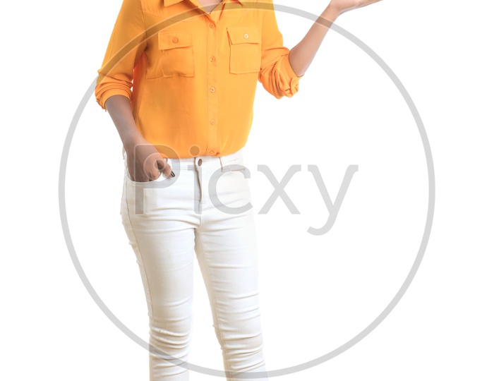 Indian woman wearing orange shirt and white pant