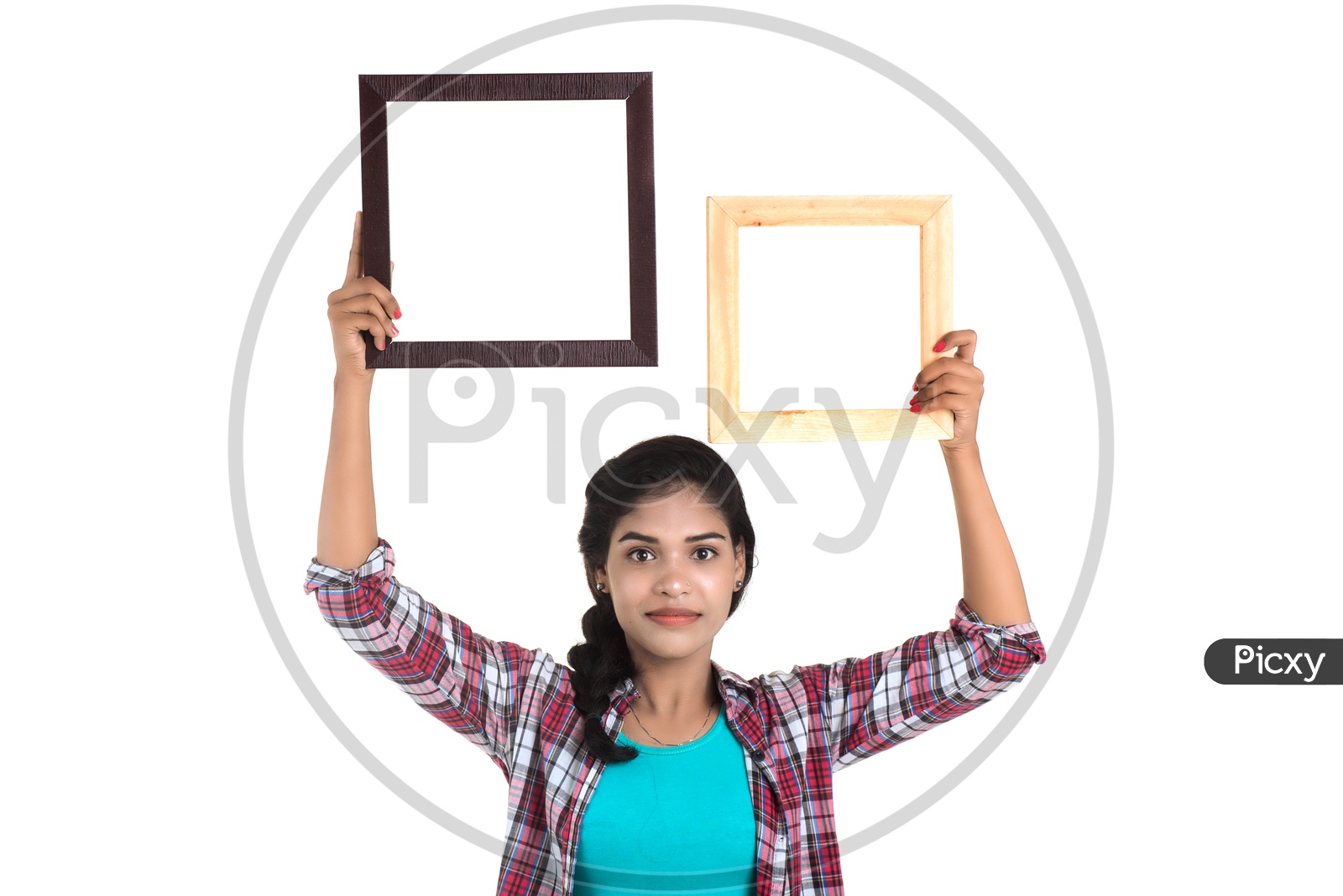 Attractive Young Woman Holding Picture Frames and Posing On White Background