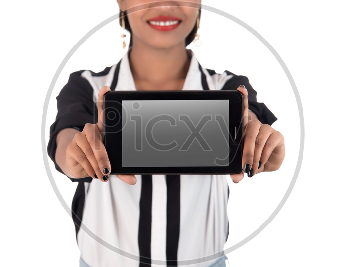 A Young Pretty Girl Showing Smart Phone Blank Screen and Showing Empty Space  on an isolated White Background