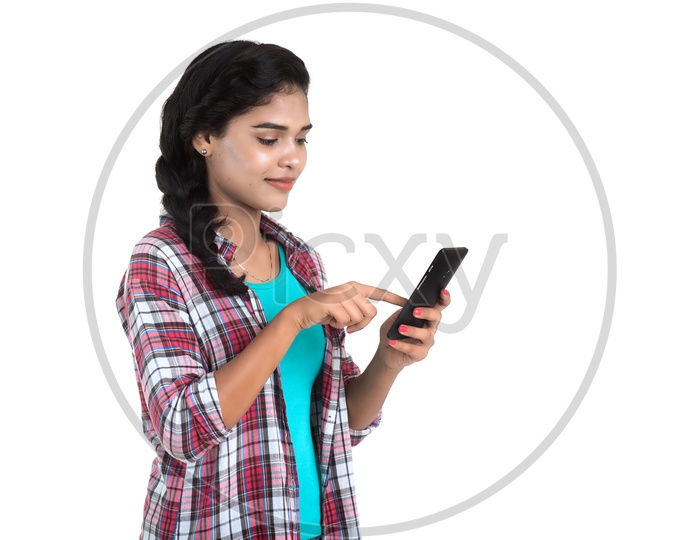 Young Pretty Indian Girl Using Smart Phone On an Isolated White Background