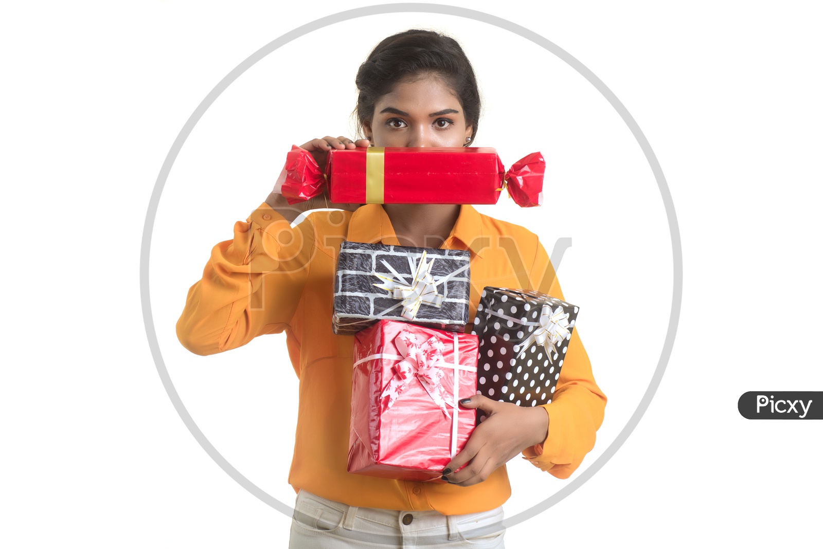 Young Girl Holding Gift Boxes  in Hand  with Smile On her Face On an Isolated White Background