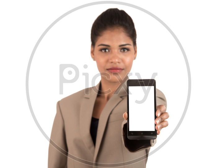 Young beautiful woman holding blank screen smart phone on white background