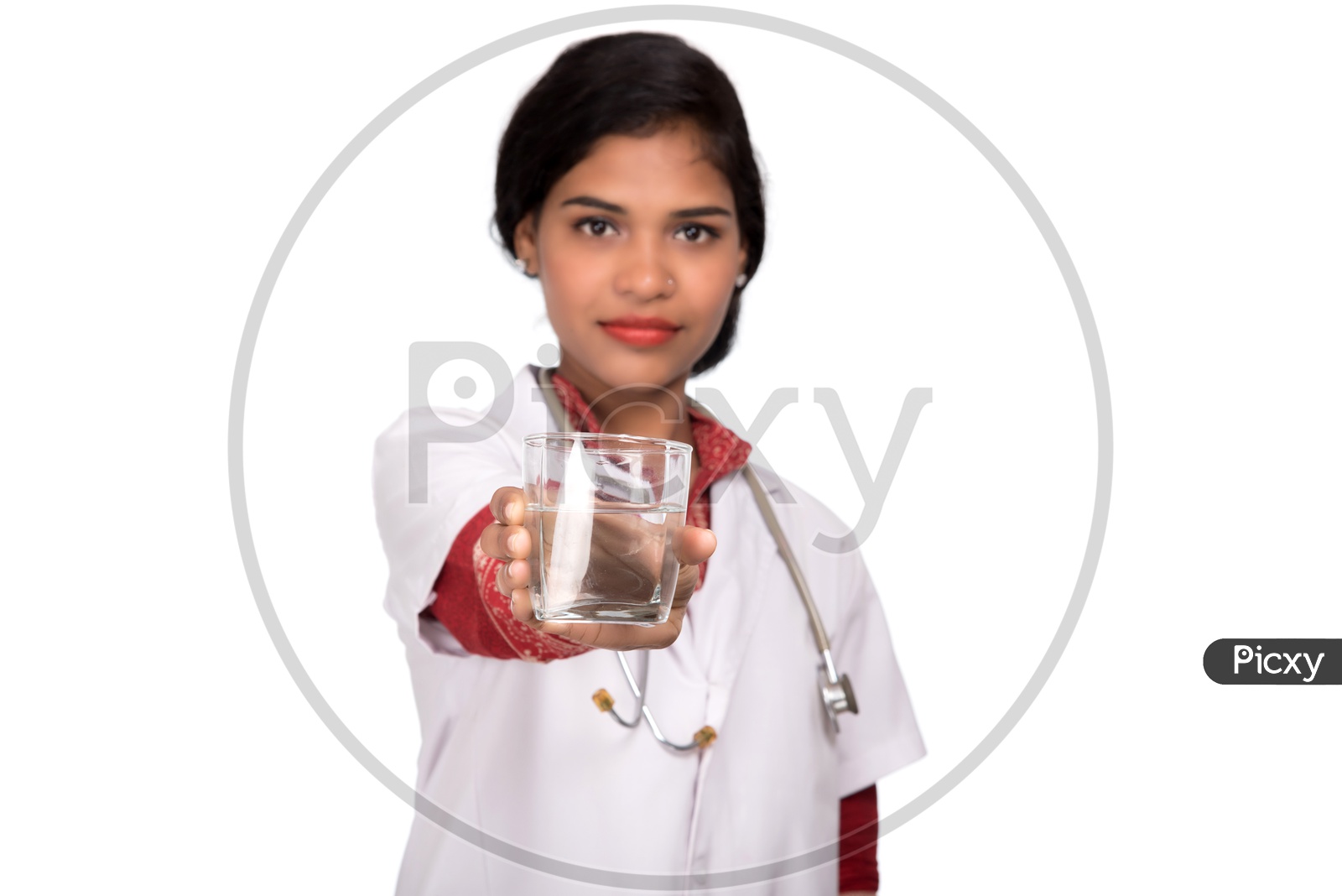 Indian Female Doctor holding a glass of water