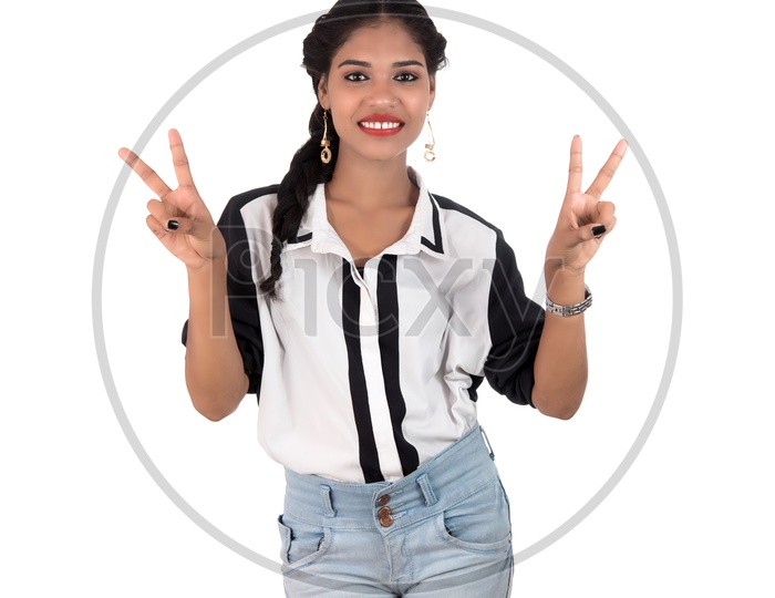 Young Beautiful Woman Showing Gestures And Smile On Face On an Isolated White Background