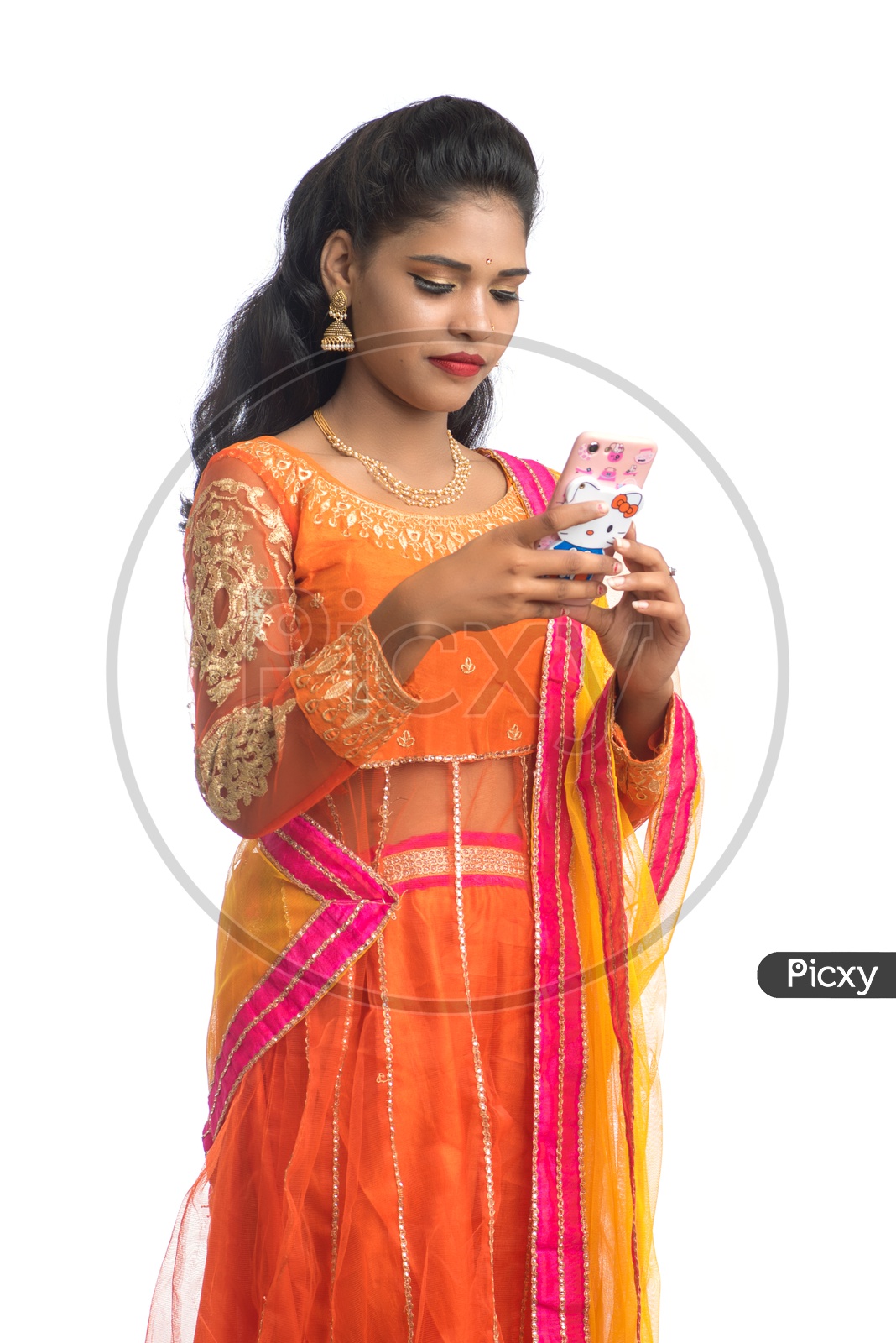 Young Indian Traditional Girl Using Smart phone over White background
