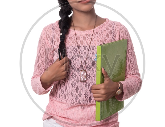 Young Attractive Girl Holding A Book in Hand Posing On White Background