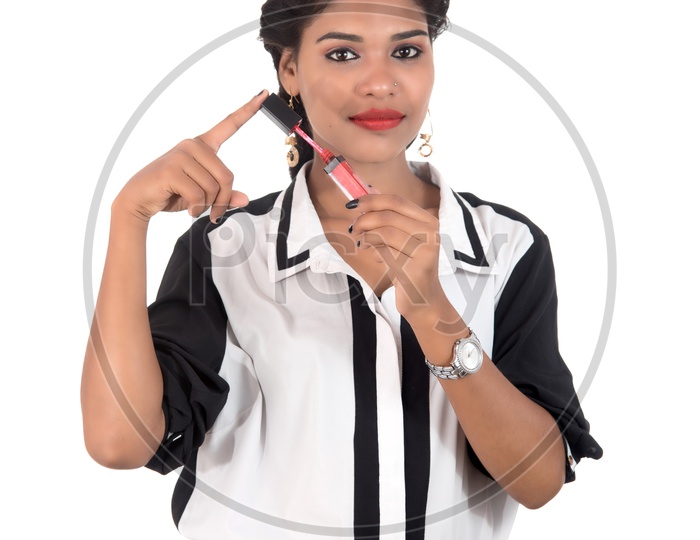 An Young Indian Girl Holding Lipstick and Posing On White Background