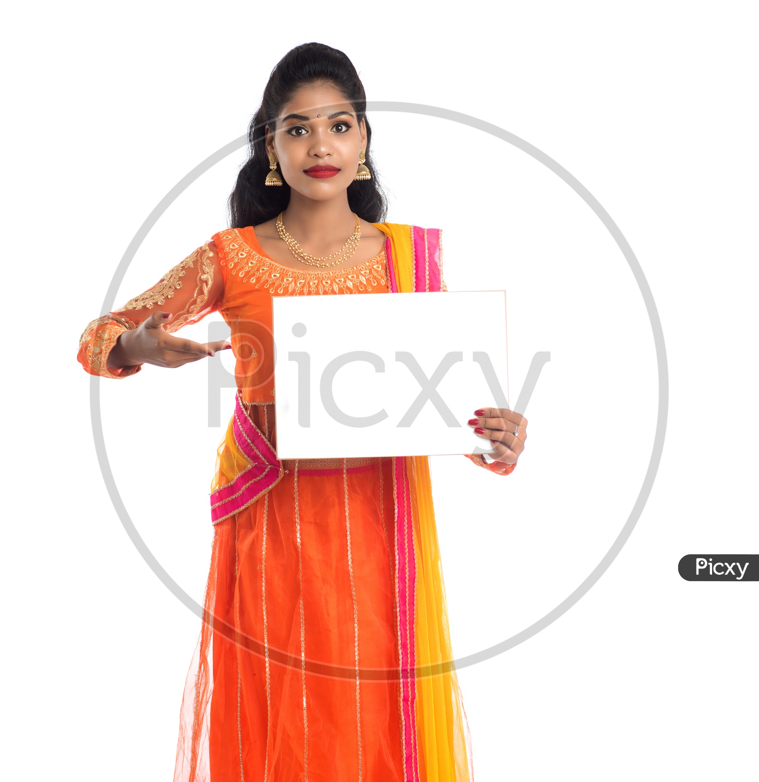 A young pretty Indian woman holding a blank white board or card