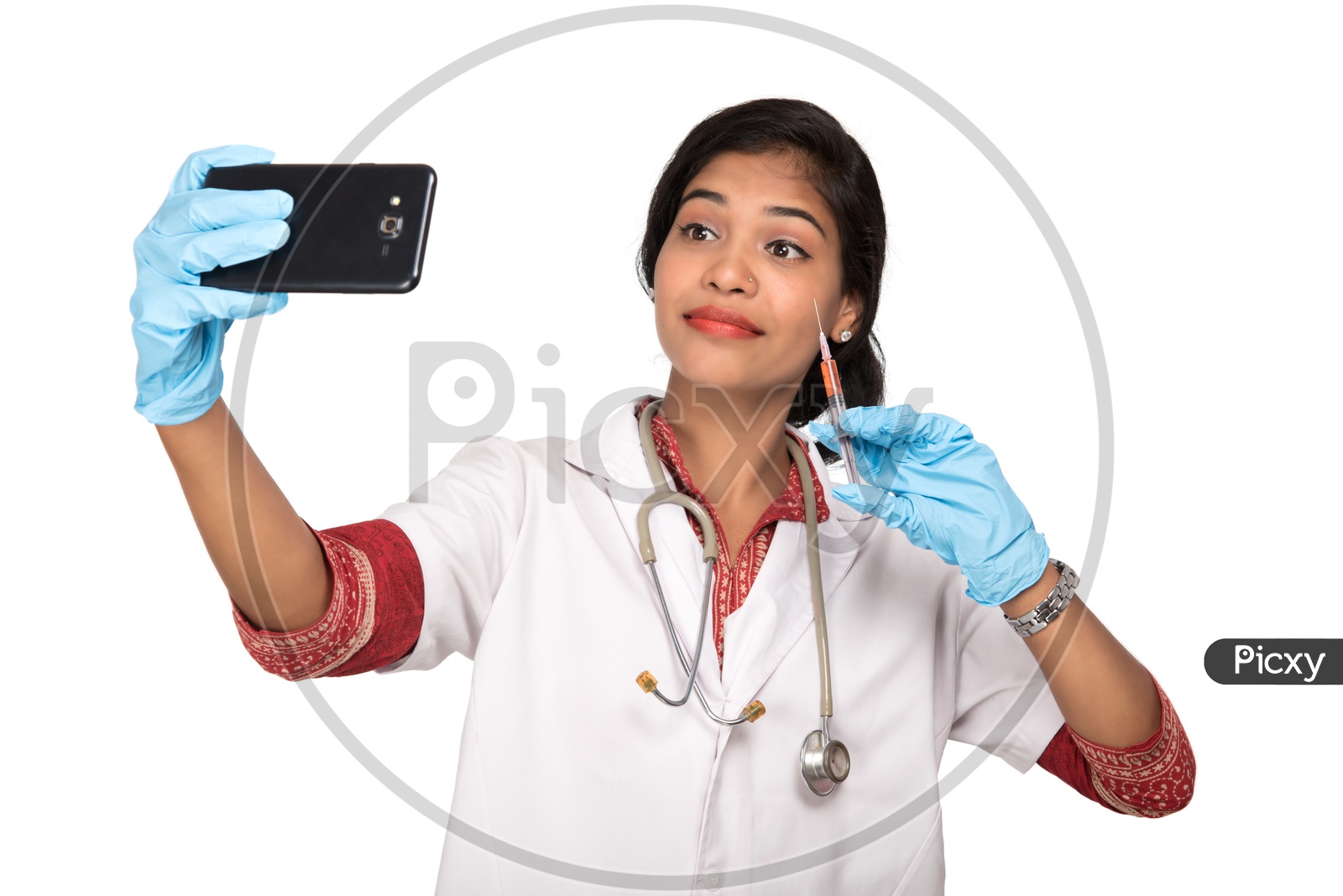 Indian Female Doctor taking selfie with a loaded syringe