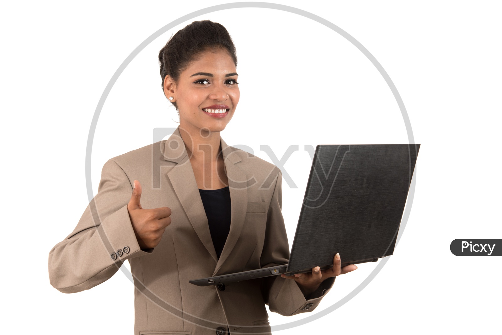 Young Indian business woman with a laptop making thumbs up sign