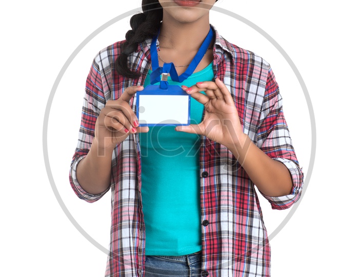 Young Girl Holding Blank Identification Card And Showing Space on Card On an Isolated White Background