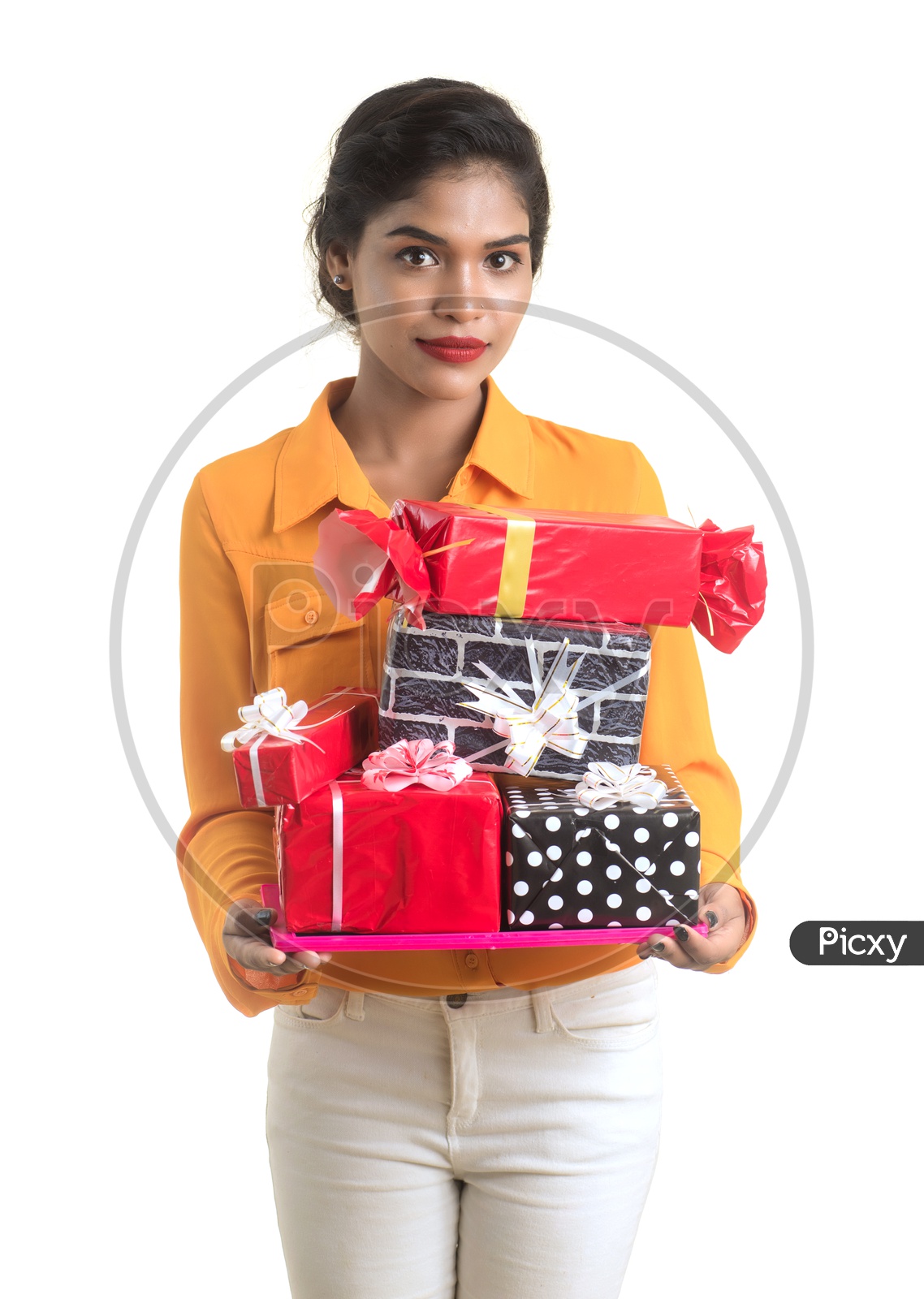 A Pretty Young Indian Girl With Gift Boxes Holding In Hand On an Isolated White Background