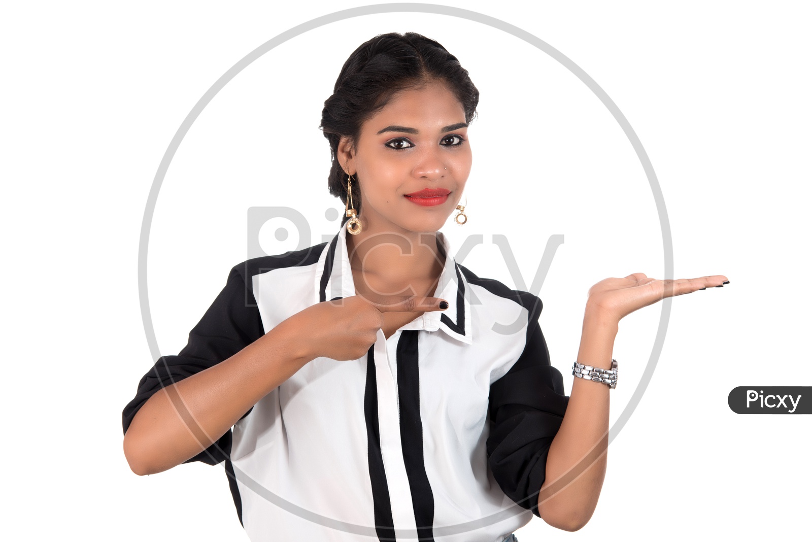 Young Beautiful Girl Holding Something In Hands  and Showing Space  With  a Smile Face Over an Isolated White Background