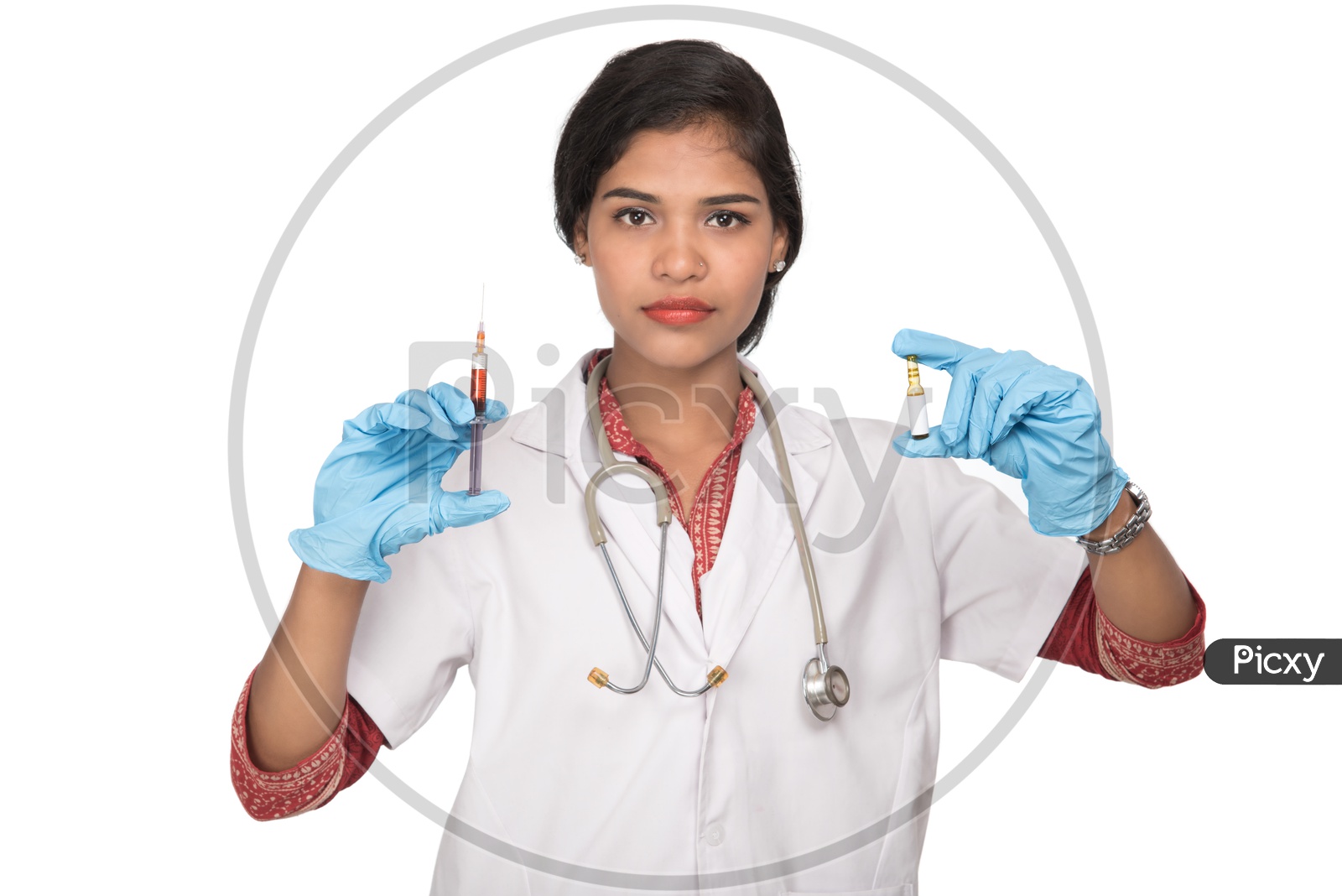 Indian Female Doctor with a loaded syringe and ample