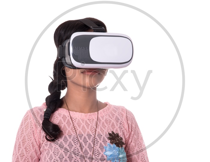 Beautiful Indian Girl Looking Through VR Device , Indian Girl Wearing Virtual Reality Headset  on a White Background