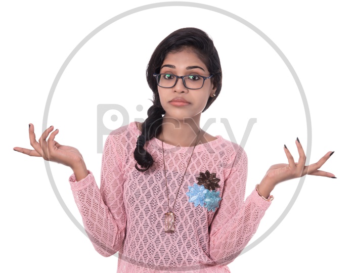 Innocent Young Indian Girl With Cute Expressions on Her Face  On White Background