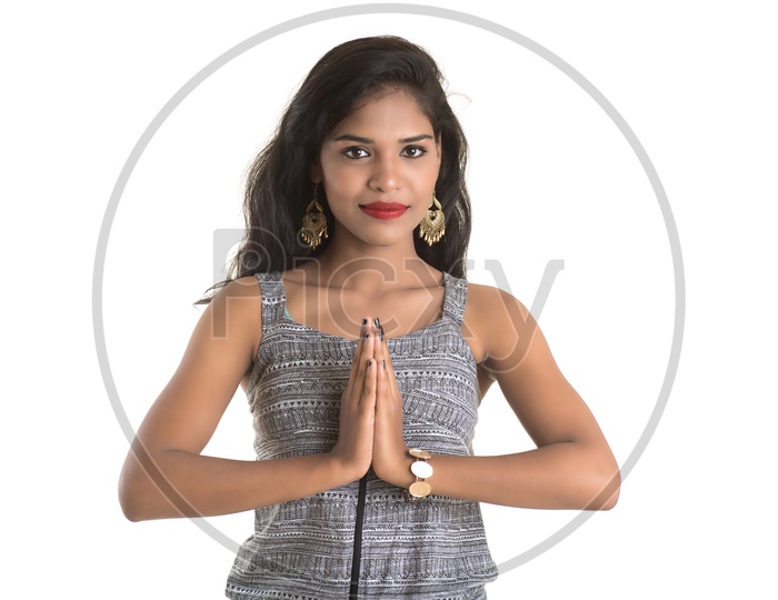 Pretty Young Girl With Namaste Gesture And With Smile Face On an Isolated White Background