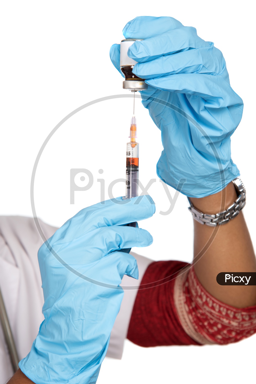 Indian Female Doctor loading a syringe from vial
