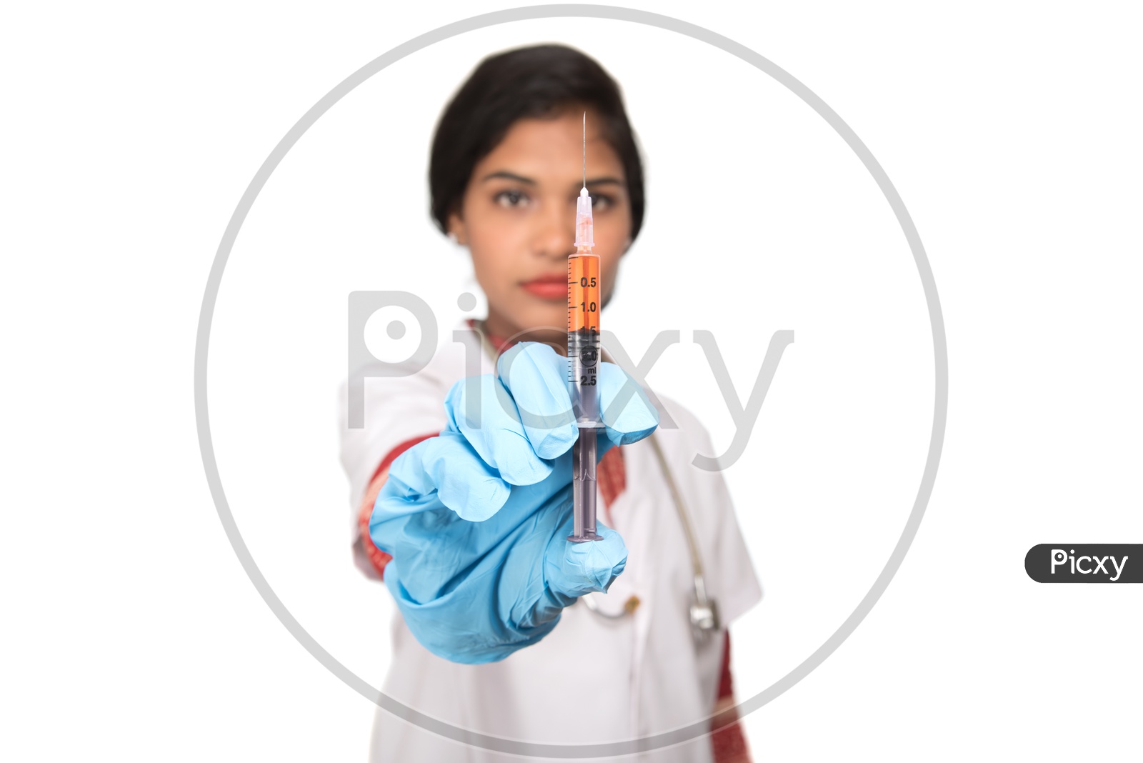 Indian Female Doctor with a loaded syringe