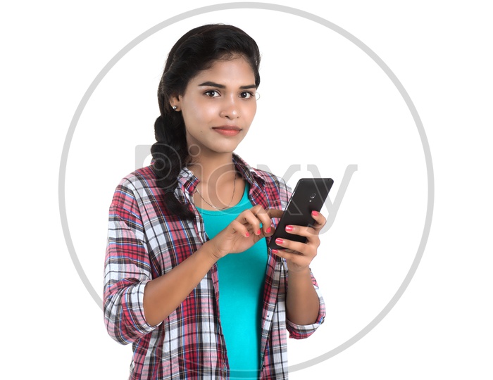Young Indian Girl Using Smart Phone On an Isolated White Background