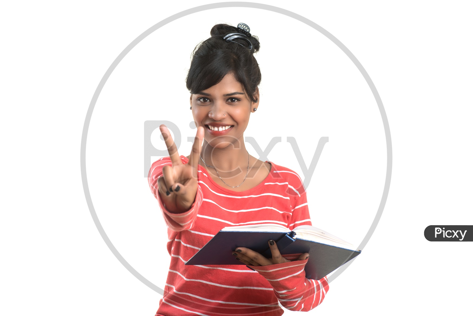 Pretty Young Girl Student Holding Book and  Posing on an isolated White Background