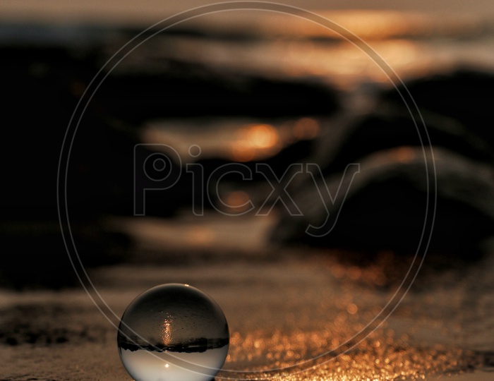 Lens Ball In a Sea Shore