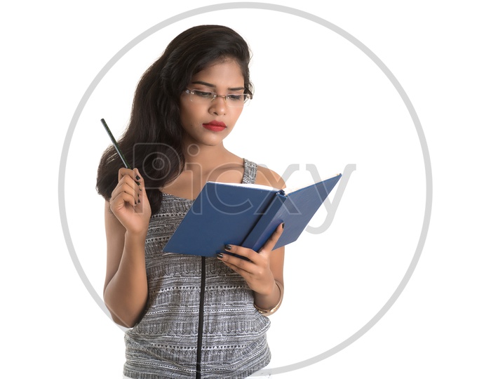 Pretty Young Girl Student Holding Book with pretty expressions and  Posing on an isolated White Background