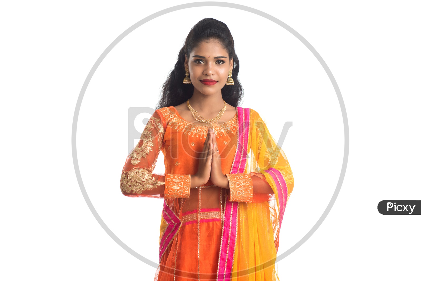 Portrait Of a Young Indian Woman Gesturing Namaste  With a Smiling Face and Posing On an Isolated White Background