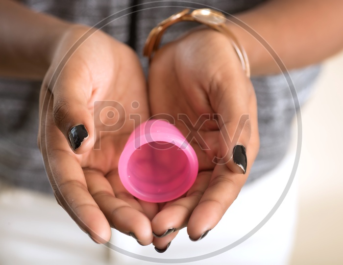 Menstrual Cup in the hands of a Indian Woman