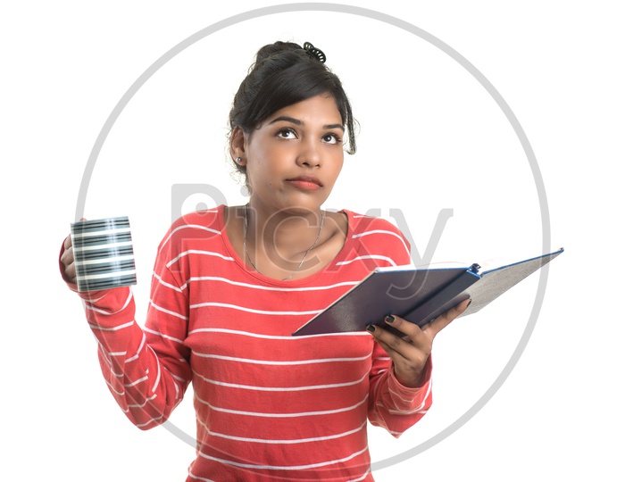 Pretty Young Girl Student Holding Book and With a Cup Of Coffee or Tea  and  Posing on an isolated White Background