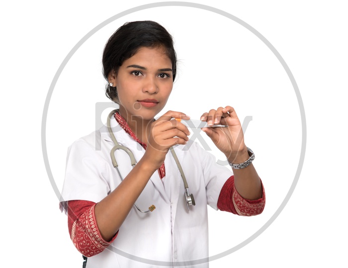 Young Woman Doctor Checking Thermometer on an Isolated White Background