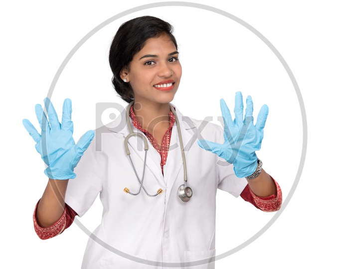 Young Lady Doctor Wearing Surgical Gloves And Posing On an Isolated White Background