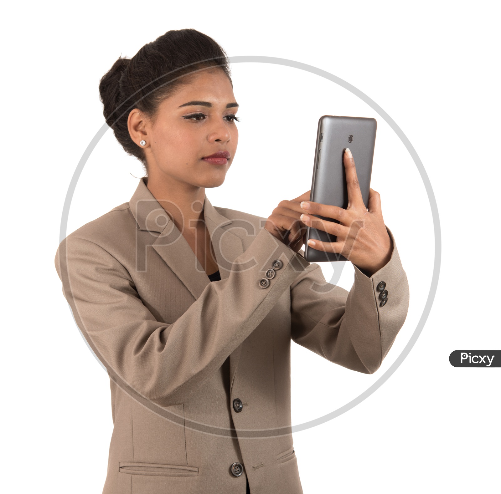 Young Indian business woman using a mobile phone or smartphone isolated on a white background