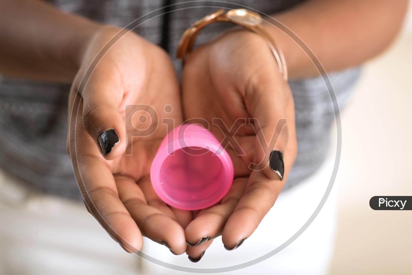 Menstrual Cup in the hands of a Indian Woman