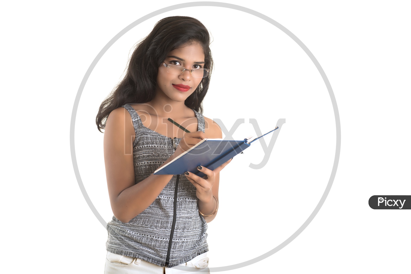 Pretty Young Girl Holding an Open Book In Hand And Posing On an Isolated White Background