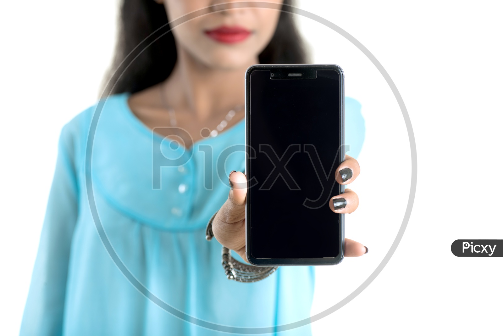 Young Indian Girl Showing  the Blank Mobile Screen and Pointing The Space On an Isolated White Background