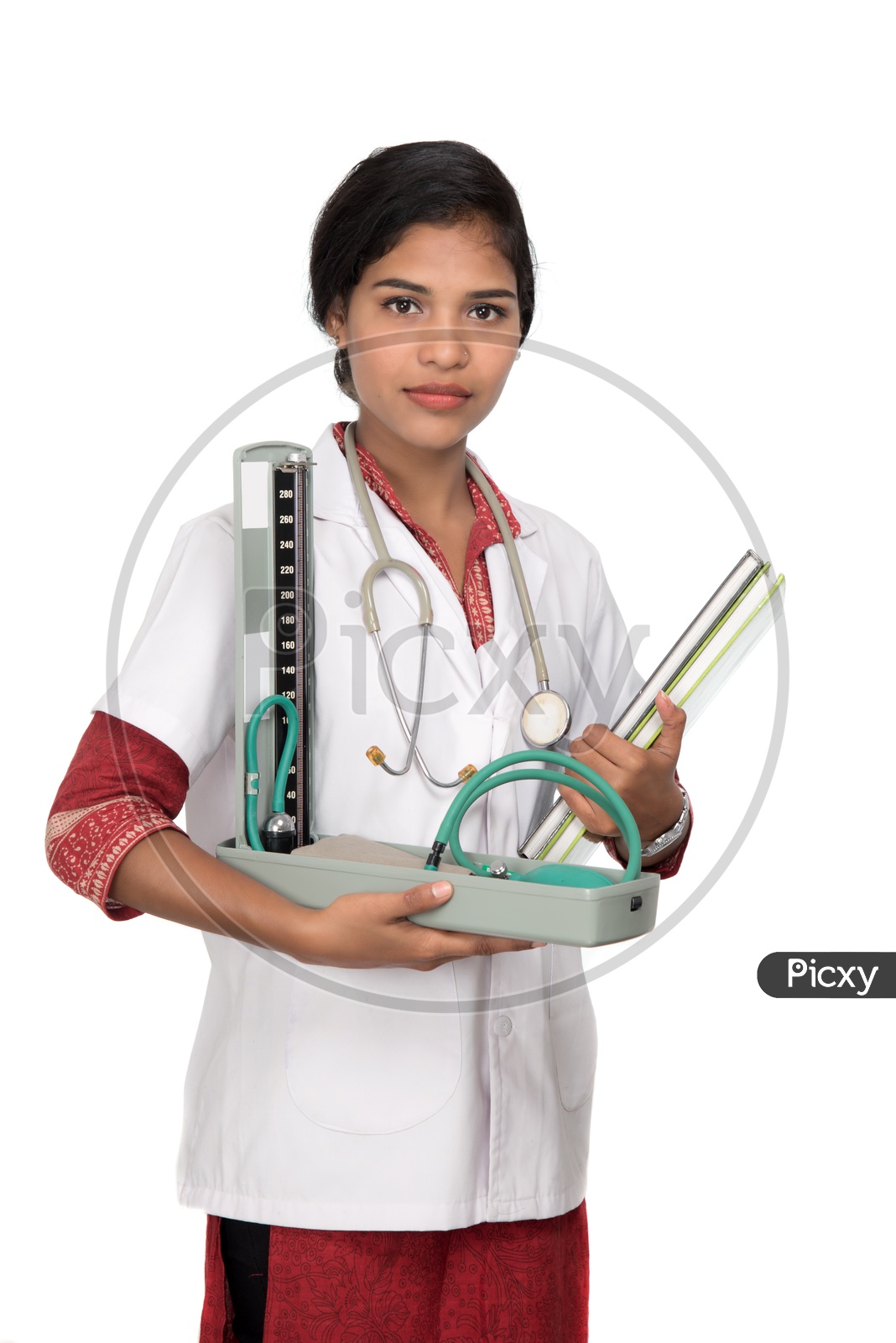 Young Lady Doctor With Blood Pressure Monitoring Gadget in Hand On an Isolated White Background