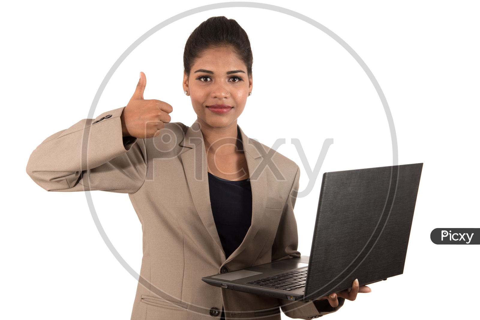Young Indian business woman holding a laptop giving thumbs up