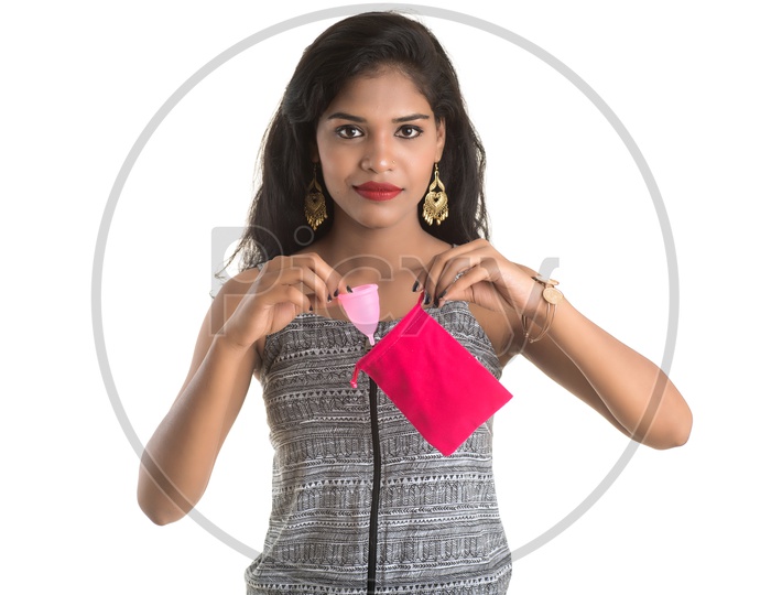 Indian woman putting a menstrual cup in pouch