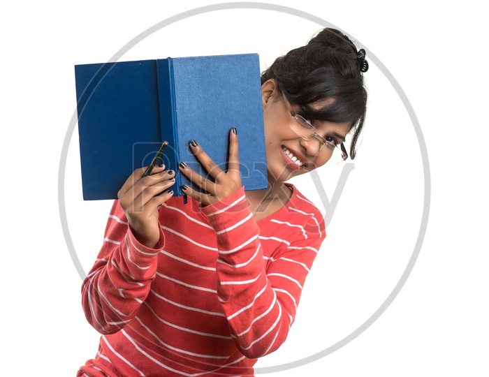 Pretty Young Girl Student Holding Book and  Posing on an isolated White Background