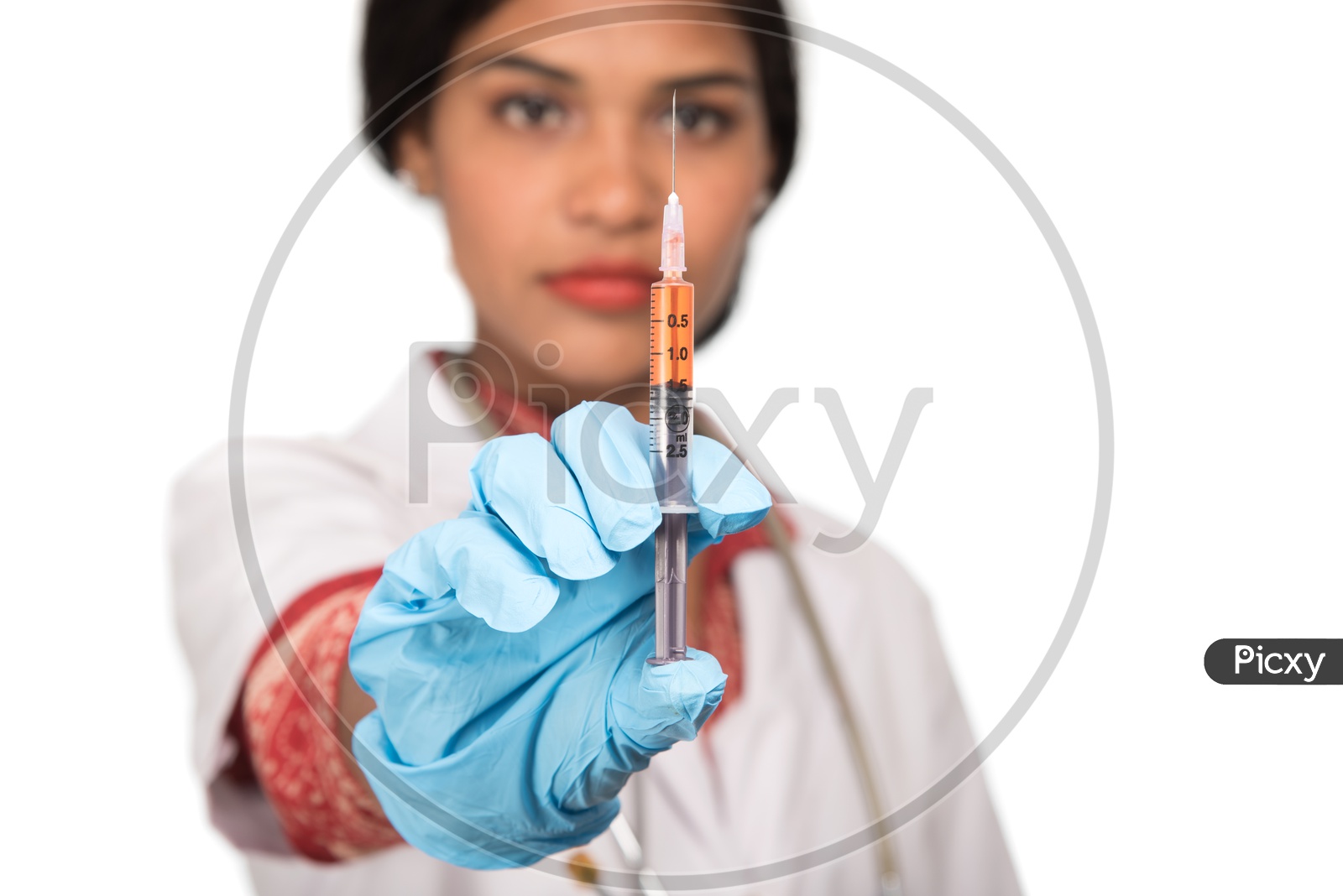 Indian Female Doctor with a loaded syringe