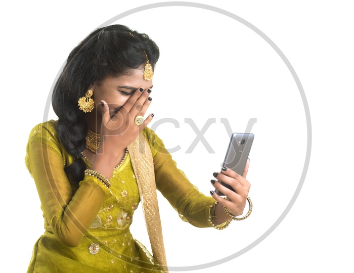 Traditional Young Indian Girl Making Video Call On Her Smart Phone and With Smile Face  On an Isolated White Background