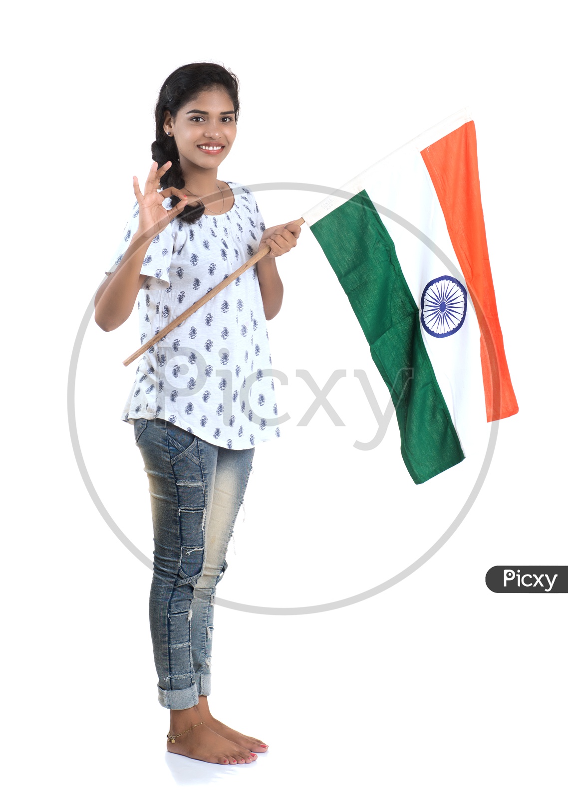 Image of Young Indian Girl Holding Indian national Flag or Tri color