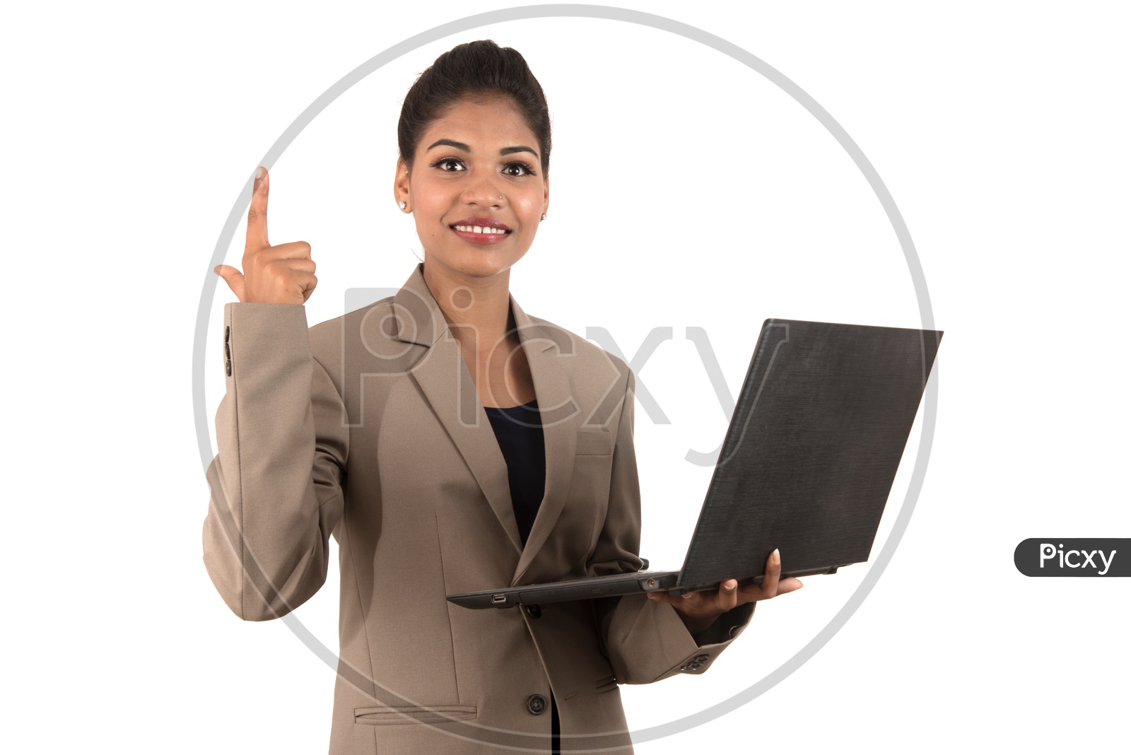 Young Indian business woman holding a laptop