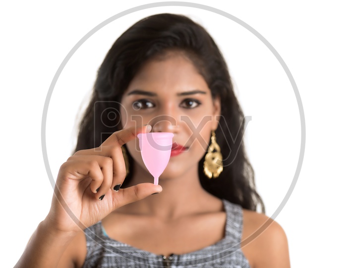 Indian woman holding a menstrual cup