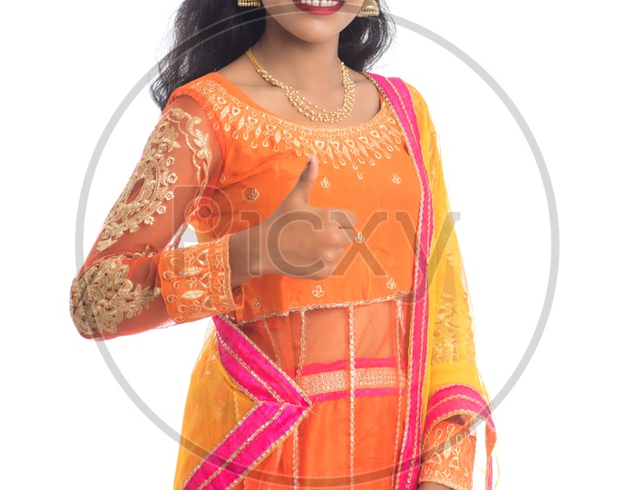 Portrait Of a  Young Indian Woman Posing With a Smile Face Over an Isolated White Background
