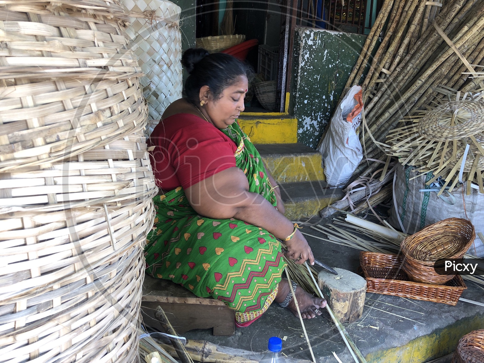 Indian Woman during the making of bamboo basket