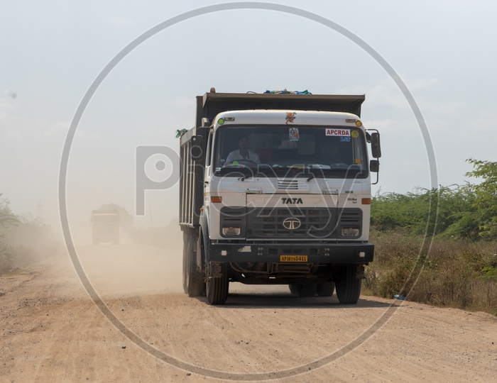 Heavy Transport Vehicles or Trucks  on  Working at AP CRDA Region For Construction.