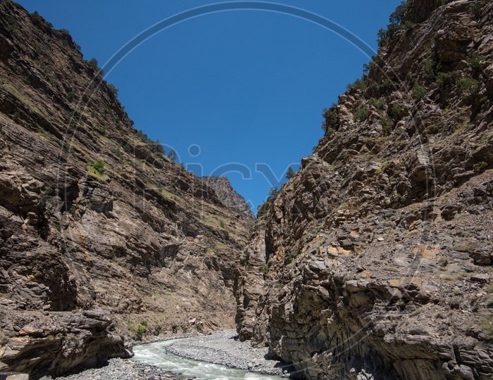 River stream between the rocky mountains in Spiti Valley