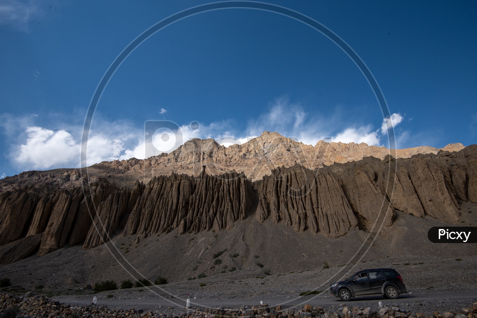A car on the mountain road in Spiti Valley